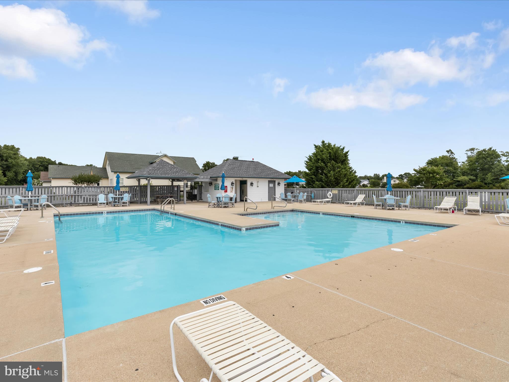 4 Cromwell Drive Ocean View, DE 19970 - Photo 50 of 59 a view of a swimming pool with an outdoor seating
