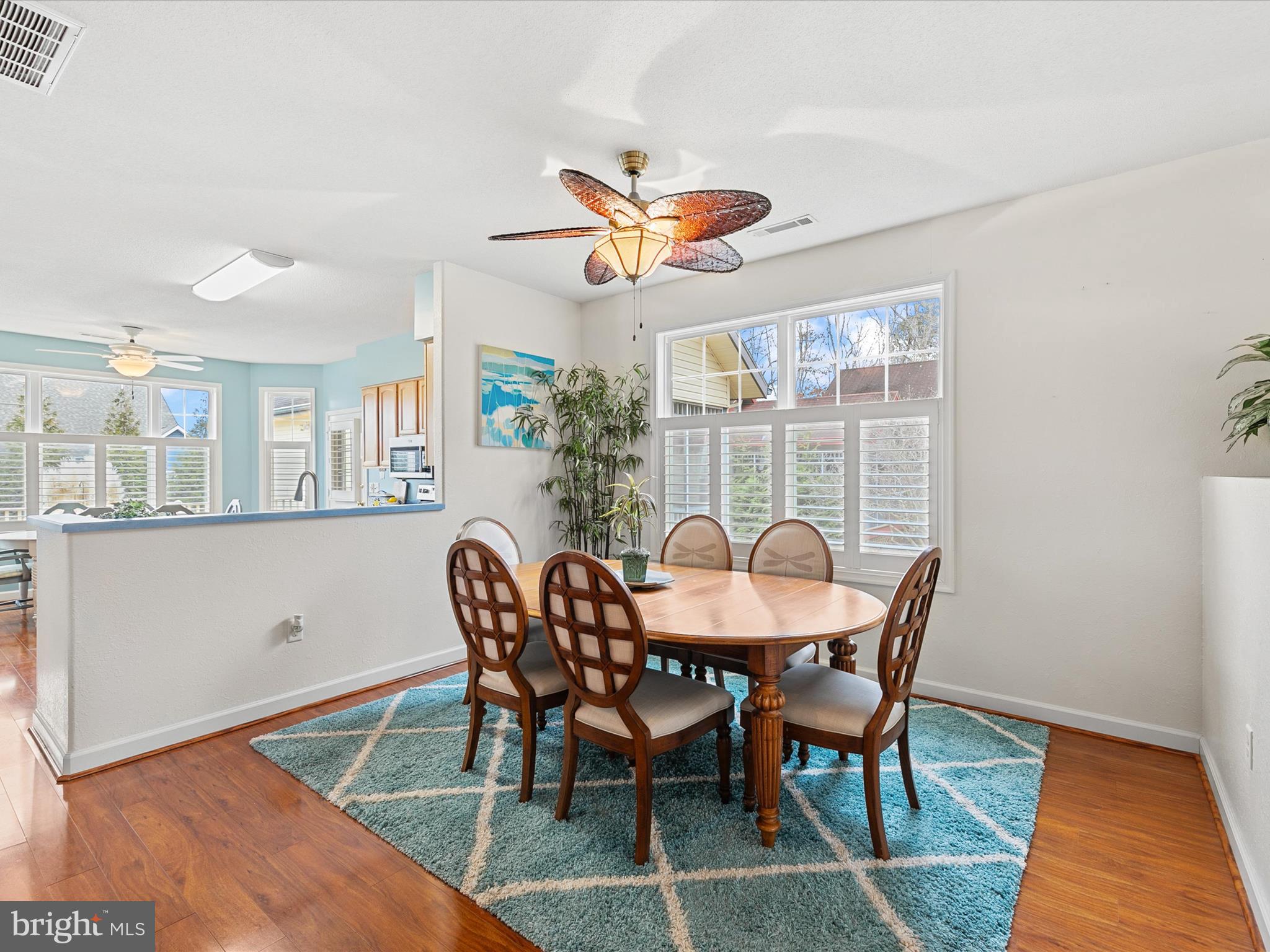 4 Cromwell Drive Ocean View, DE 19970 - Photo 9 of 59 a dining room with furniture a rug and a chandelier