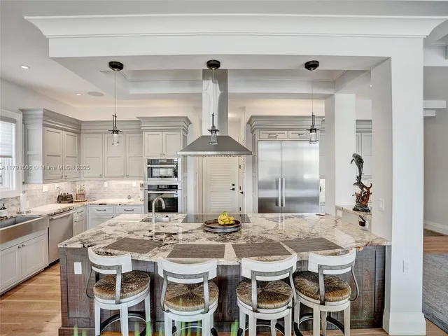 a kitchen with a table and chairs in it