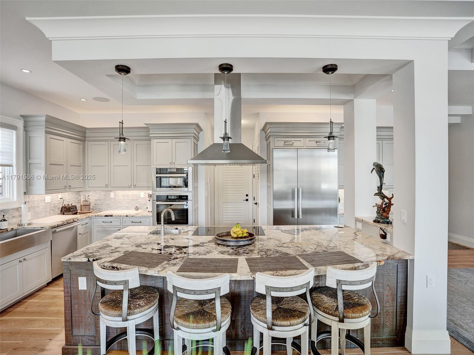 2340 Northeast 48th Street Lighthouse Point, FL 33064 - Photo 16 of 48 a kitchen with a table and chairs in it