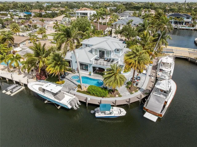 an aerial view of a house with a ocean view