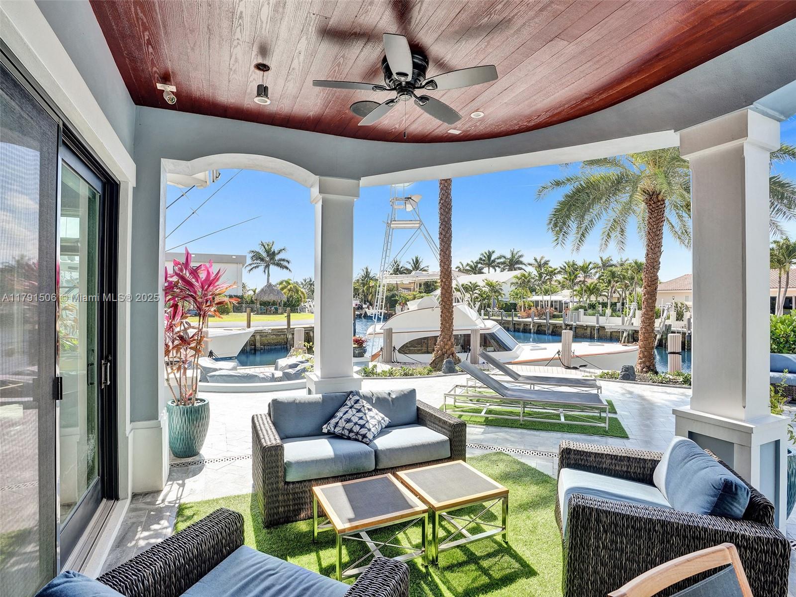 2340 Northeast 48th Street Lighthouse Point, FL 33064 - Photo 35 of 48 a living room with furniture and a large window