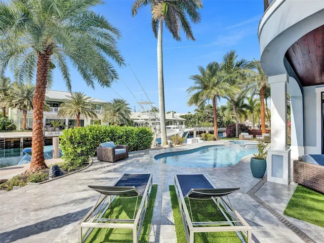 a view of swimming pool with outdoor seating