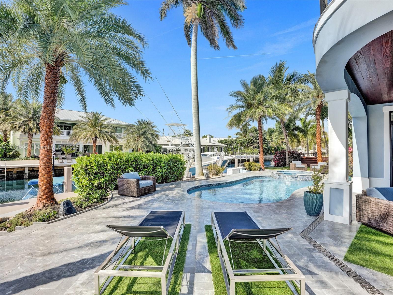 2340 Northeast 48th Street Lighthouse Point, FL 33064 - Photo 36 of 48 a view of swimming pool with outdoor seating