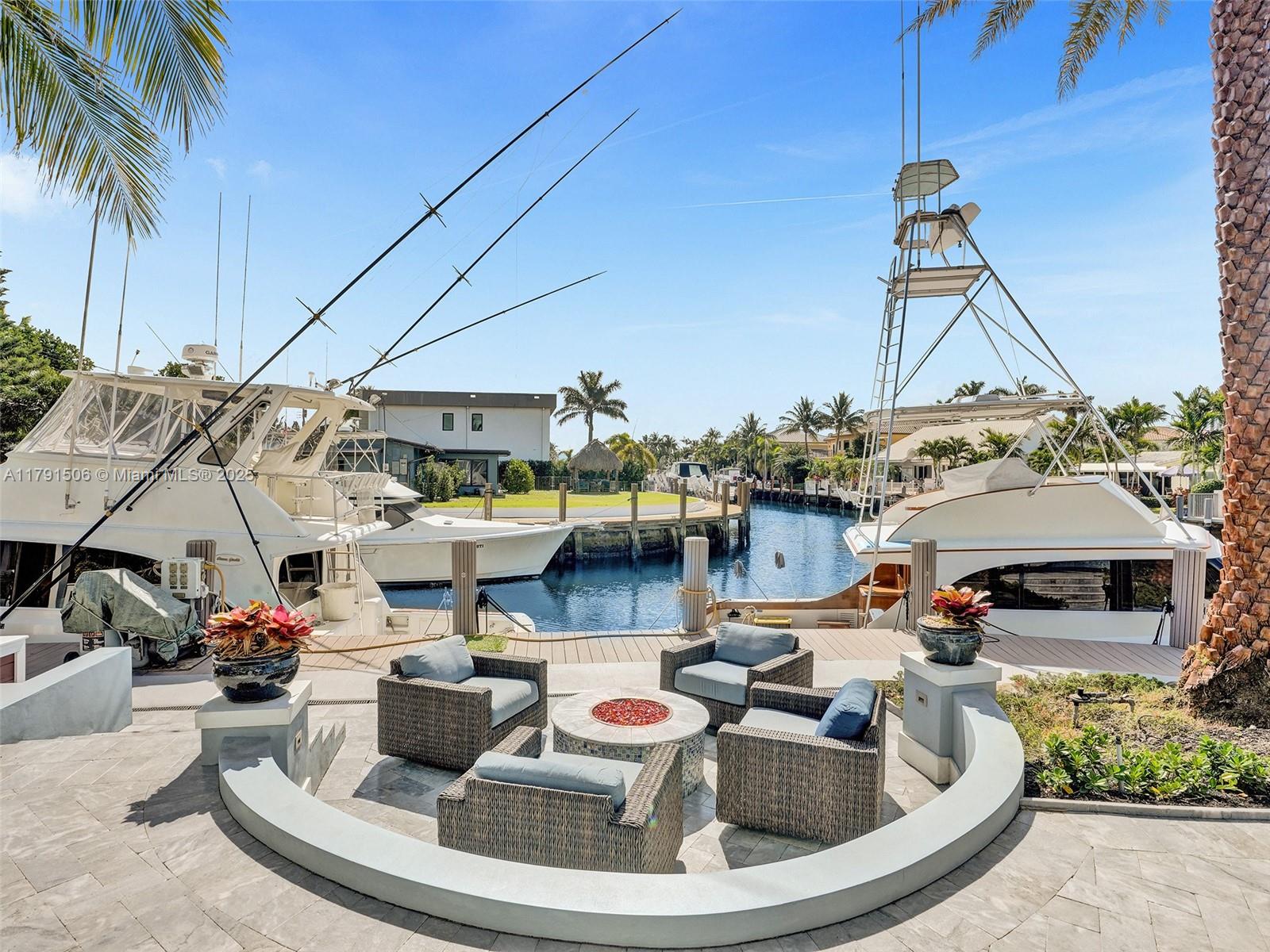 2340 Northeast 48th Street Lighthouse Point, FL 33064 - Photo 40 of 48 a view of multiple house with outdoor seating