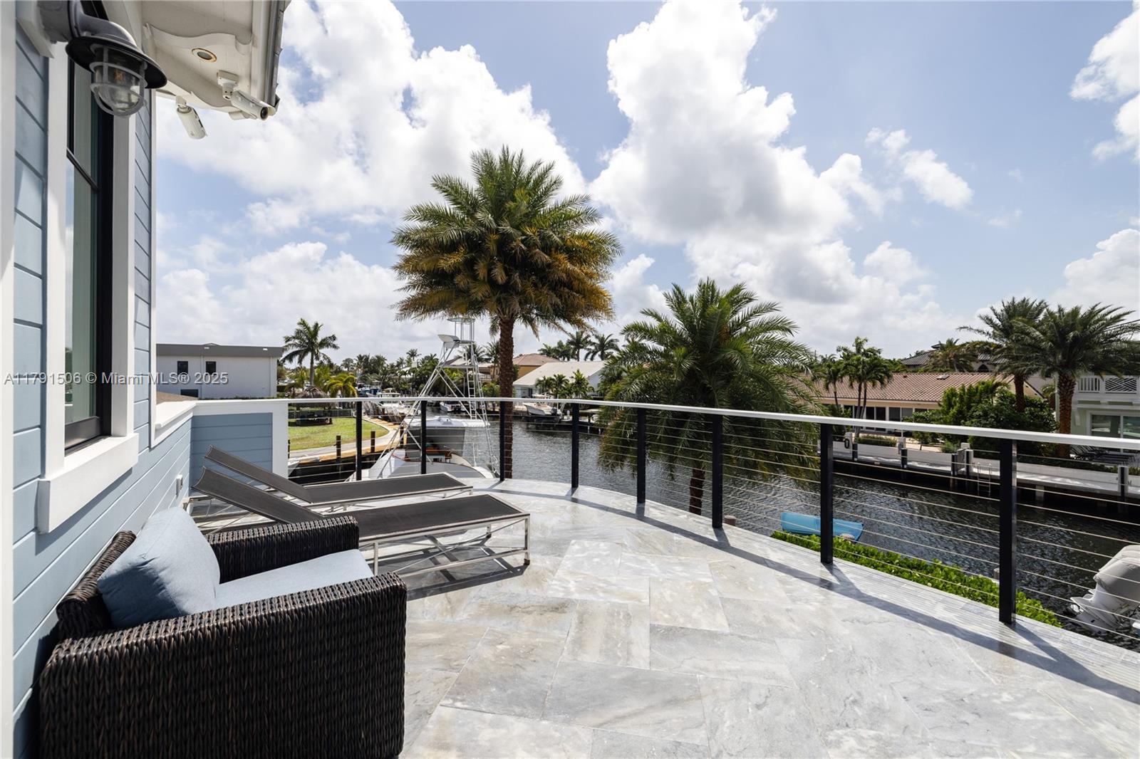 2340 Northeast 48th Street Lighthouse Point, FL 33064 - Photo 45 of 48 a view of a balcony with chairs