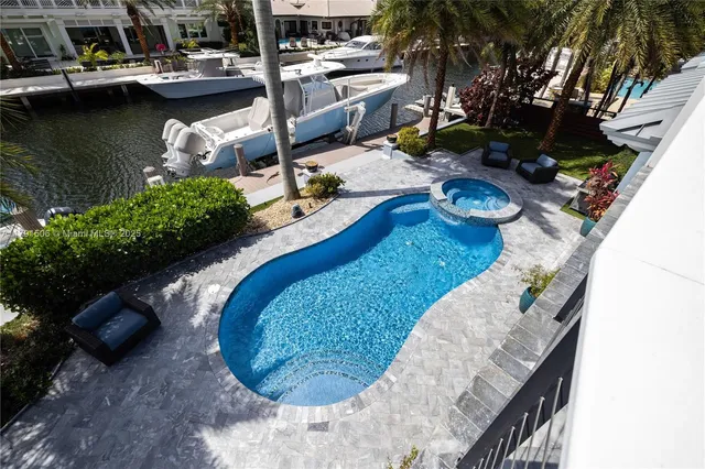 a view of a swimming pool with lounge chair