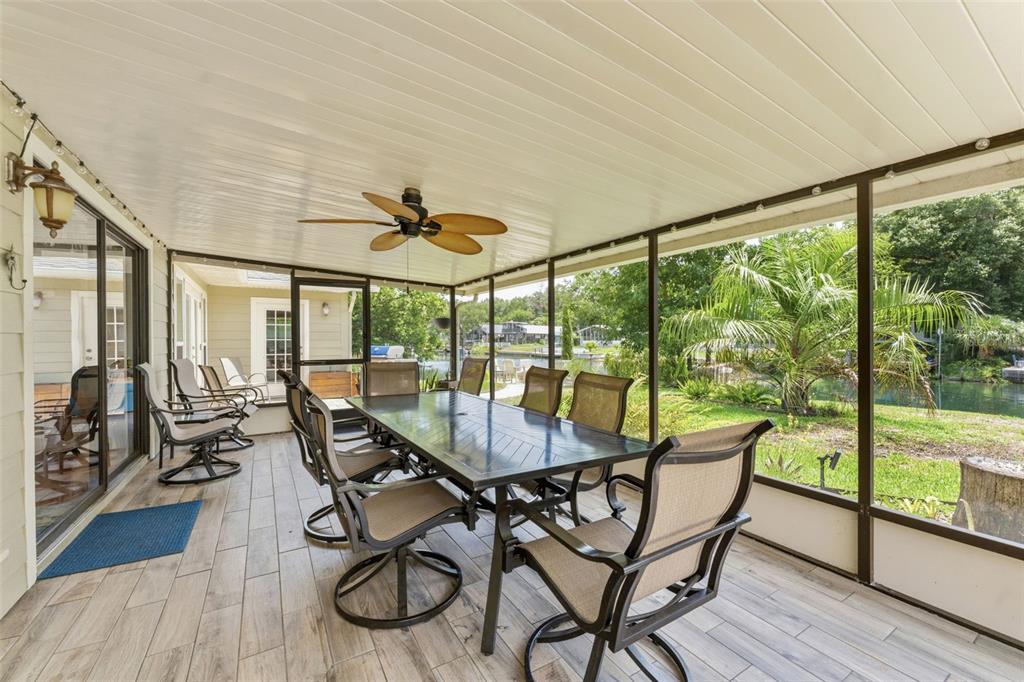 6355 Sebring Street Weeki Wachee, FL 34607 - Photo 44 of 65 a dining room with furniture water view and wooden floor
