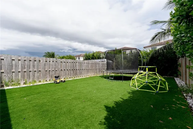 a garden with wooden fence