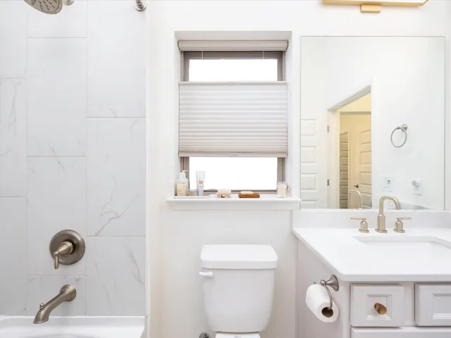 a bathroom with a sink a toilet and a bathtub