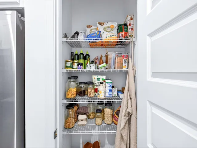 a kitchen with a refrigerator and a sink