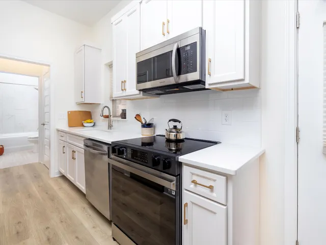 a balcony with table and chairs