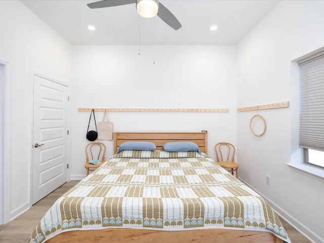 a bedroom with a bed and a window