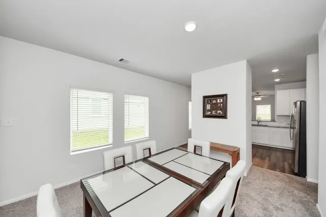 a living room with furniture and next to a window