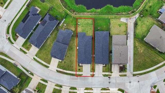 an aerial view of a house with a garden and plants