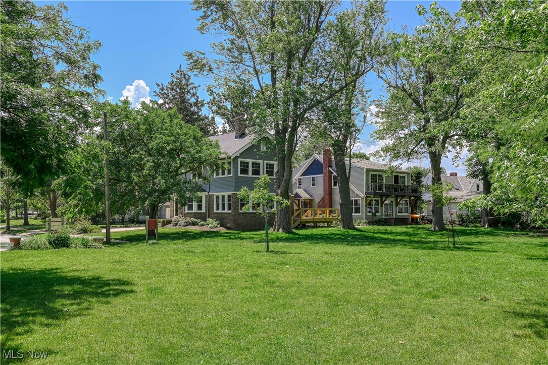 17728 Windward Road Cleveland, OH 44119 - Photo 6 of 32 View of green lawn featuring a wooden deck
