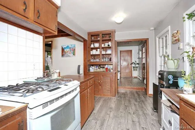 a kitchen with stainless steel appliances granite countertop a stove and a refrigerator