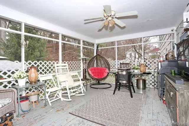 a view of a livingroom with furniture and a flat screen tv