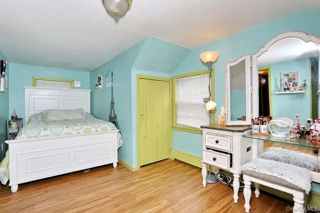 a bedroom with a bed and furniture