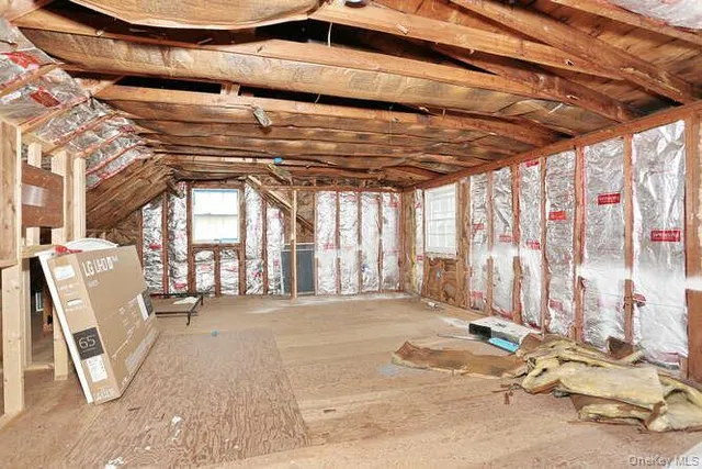 a view of a room with wooden walls and outdoor space