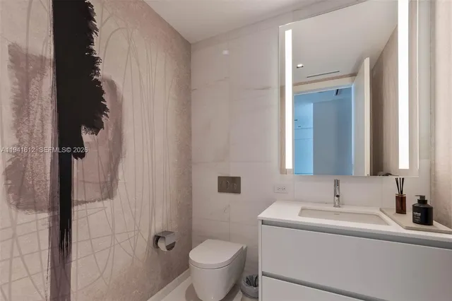 a dining room with furniture and a large window