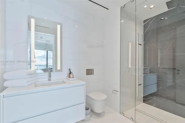 a view of a living room and kitchen