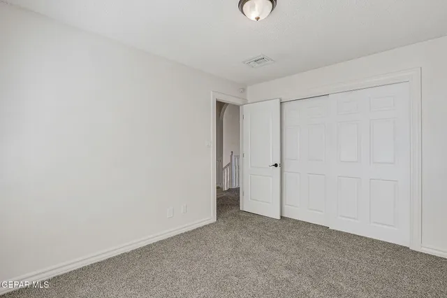 a view of a livingroom with furniture and a ceiling fan