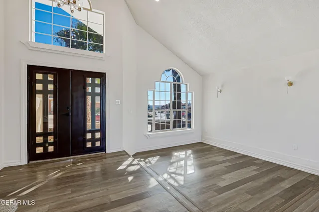 a view of a room with wooden floor and stairs