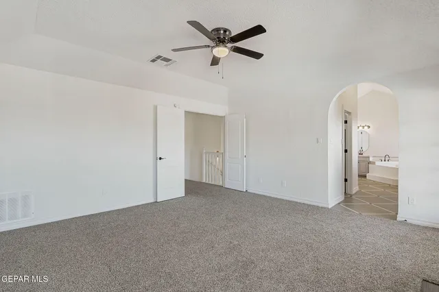 a view of a house with a balcony and bed