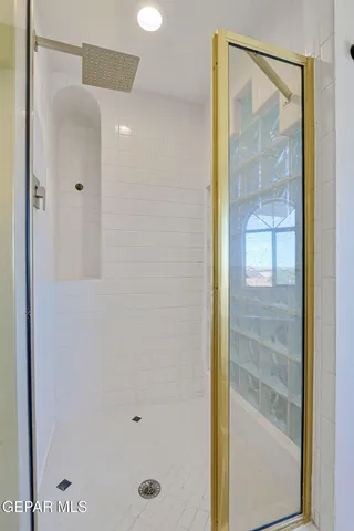 a view of a swimming pool with a lounge chair