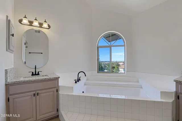 a view of a swimming pool with lounge chair