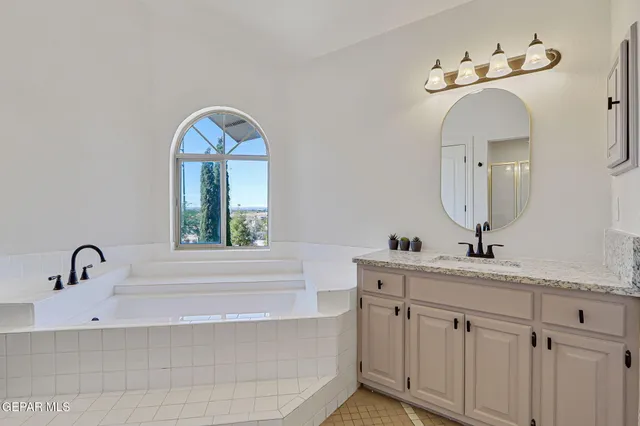a bathroom with a toilet sink and a mirror