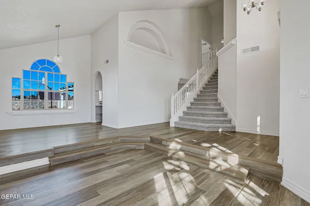 a view of wooden floor and cabinet in a room
