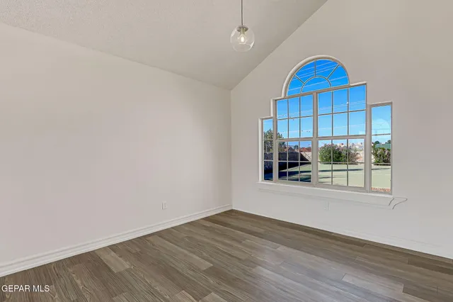 a kitchen with stainless steel appliances granite countertop a stove and a refrigerator
