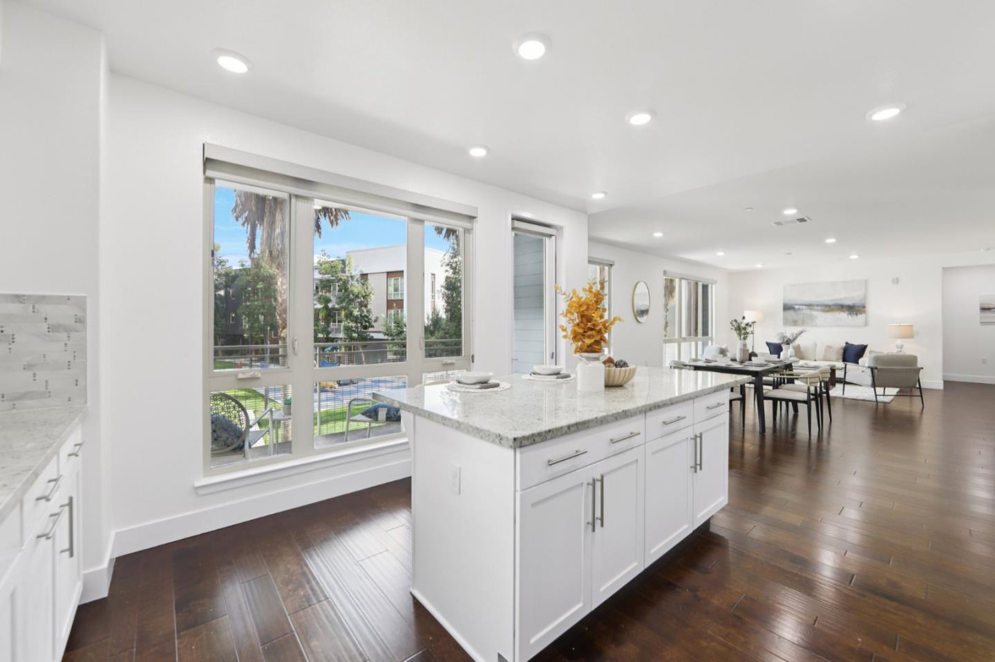 390 Riesling Avenue, Unit 21 Milpitas, CA 95035 - Photo 12 of 48 a large white kitchen with a large window