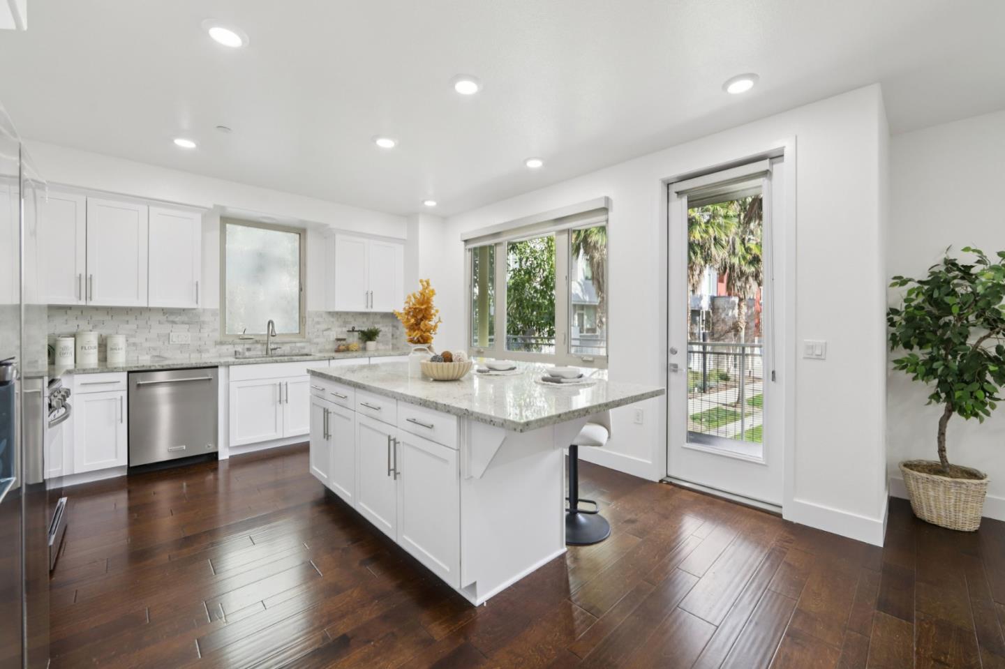 390 Riesling Avenue, Unit 21 Milpitas, CA 95035 - Photo 14 of 48 a kitchen with a stove top oven sink and cabinets