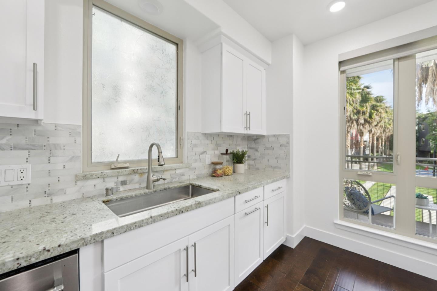 390 Riesling Avenue, Unit 21 Milpitas, CA 95035 - Photo 15 of 48 a kitchen with a sink and cabinets