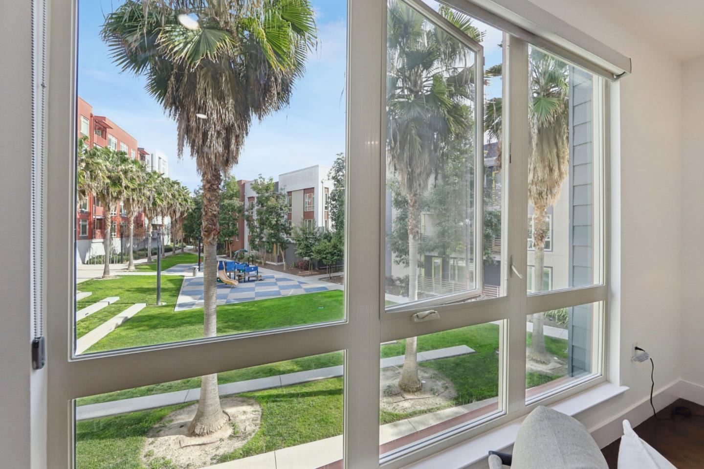 390 Riesling Avenue, Unit 21 Milpitas, CA 95035 - Photo 17 of 48 a view of swimming pool from a window