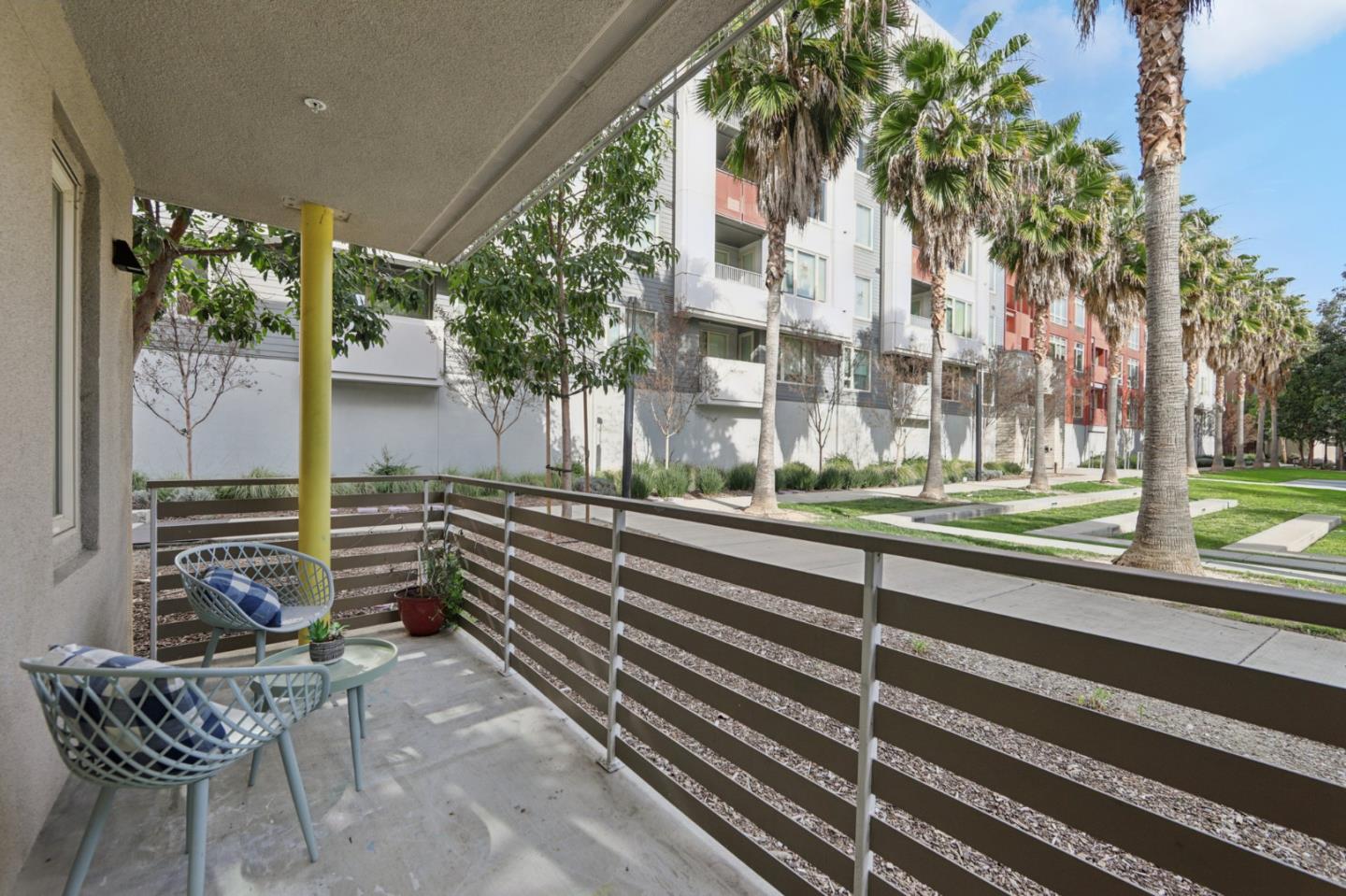 390 Riesling Avenue, Unit 21 Milpitas, CA 95035 - Photo 24 of 48 a view of a patio with a table and chairs and potted plants