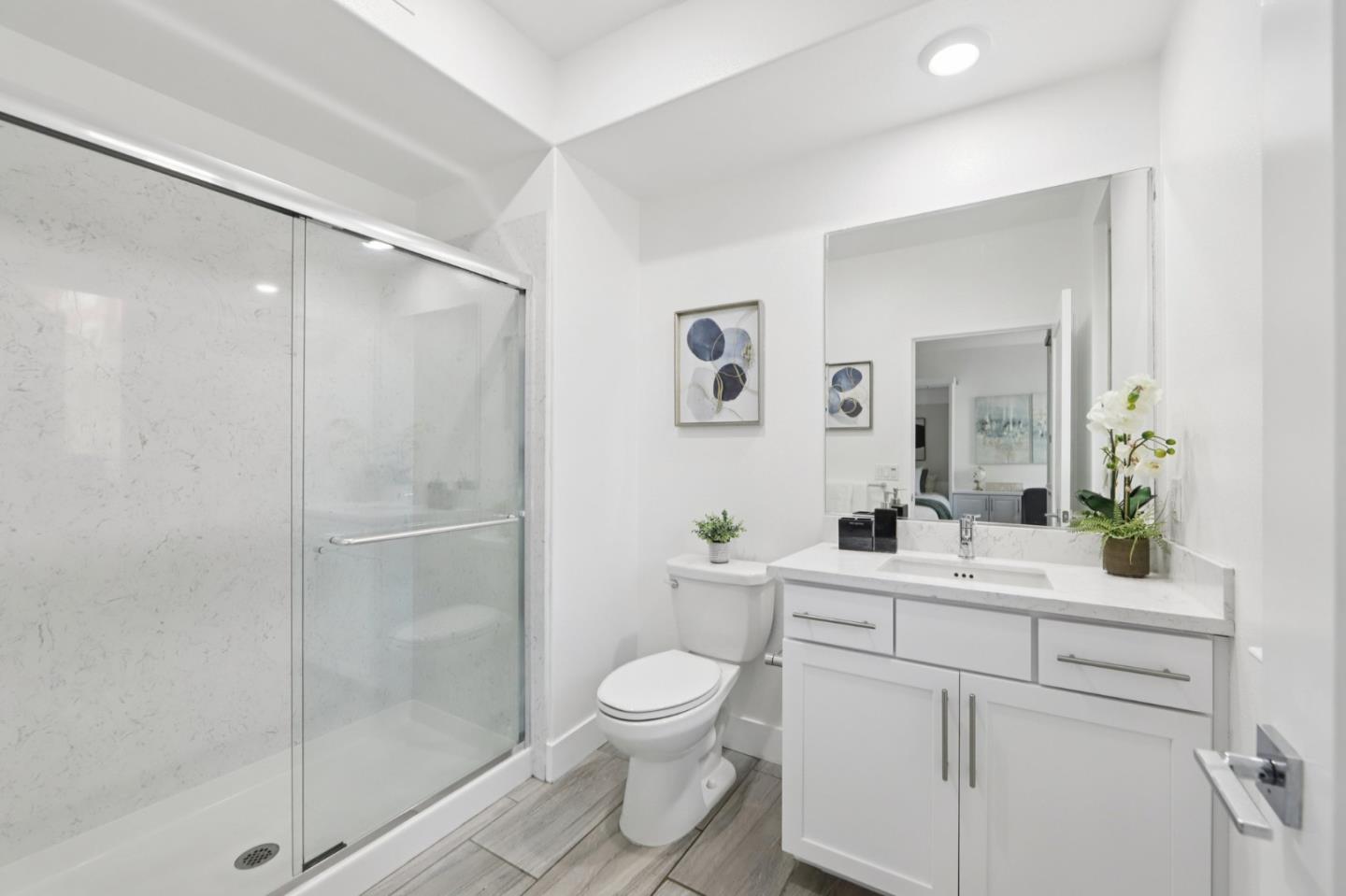 390 Riesling Avenue, Unit 21 Milpitas, CA 95035 - Photo 26 of 48 a bathroom with a toilet a sink and a mirror