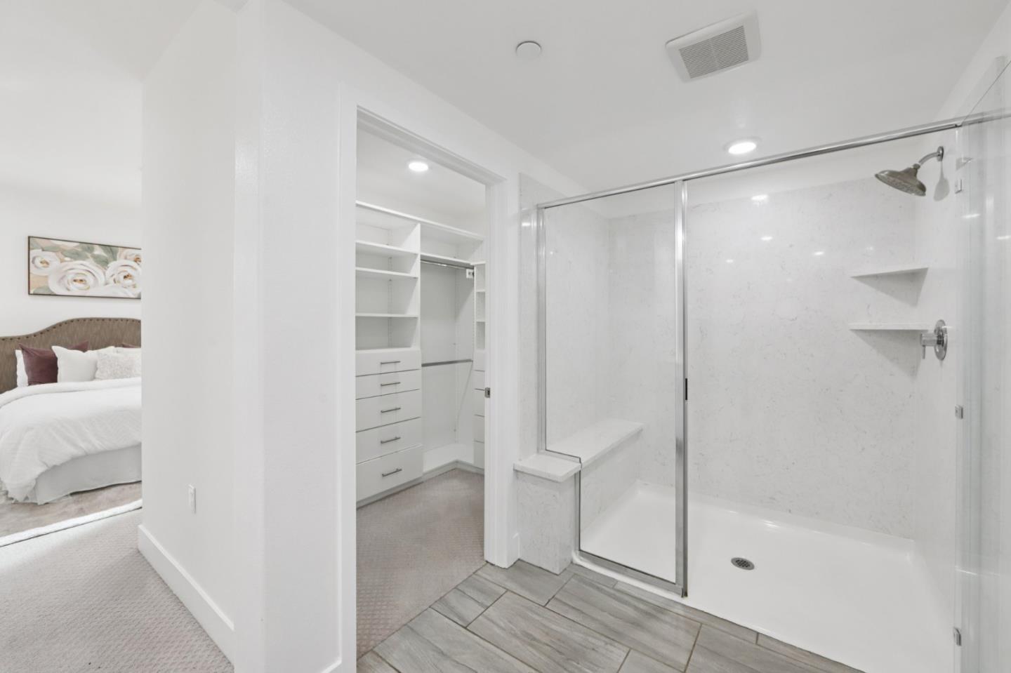390 Riesling Avenue, Unit 21 Milpitas, CA 95035 - Photo 29 of 48 a bathroom with a shower and a glass door
