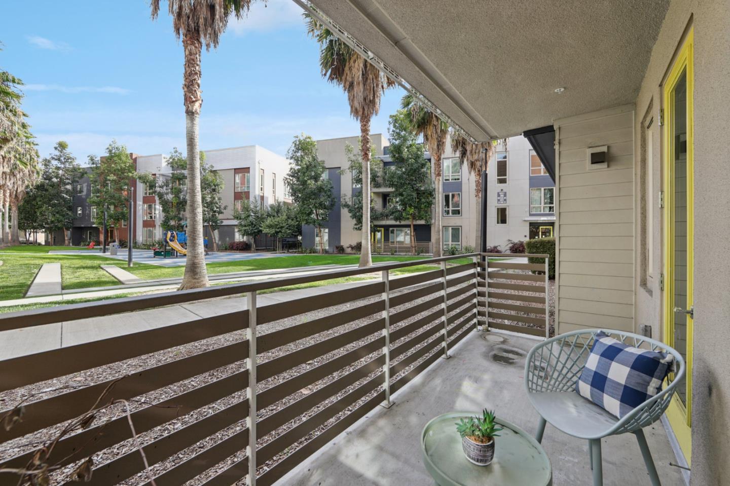 390 Riesling Avenue, Unit 21 Milpitas, CA 95035 - Photo 38 of 48 a view of a patio with a table chairs and a table