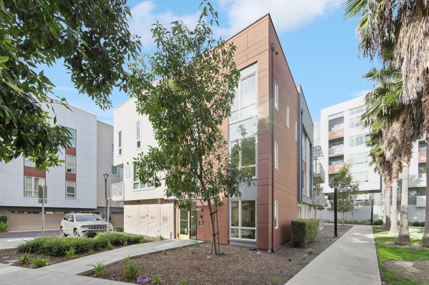 390 Riesling Avenue, Unit 21 Milpitas, CA 95035 - Photo 40 of 48 a front view of a house with a tree