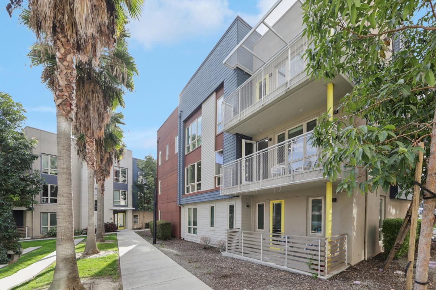 390 Riesling Avenue, Unit 21 Milpitas, CA 95035 - Photo 45 of 48 a view of a large white building among the street