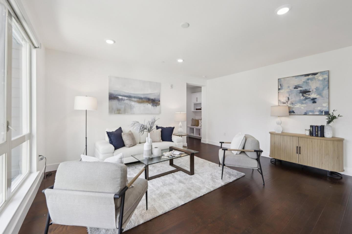 390 Riesling Avenue, Unit 21 Milpitas, CA 95035 - Photo 6 of 48 a living room with furniture and a wooden floor