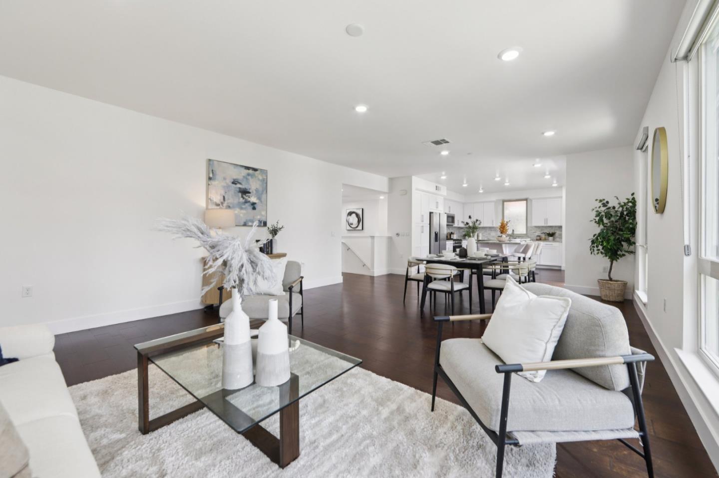 390 Riesling Avenue, Unit 21 Milpitas, CA 95035 - Photo 7 of 48 a living room with furniture and a table