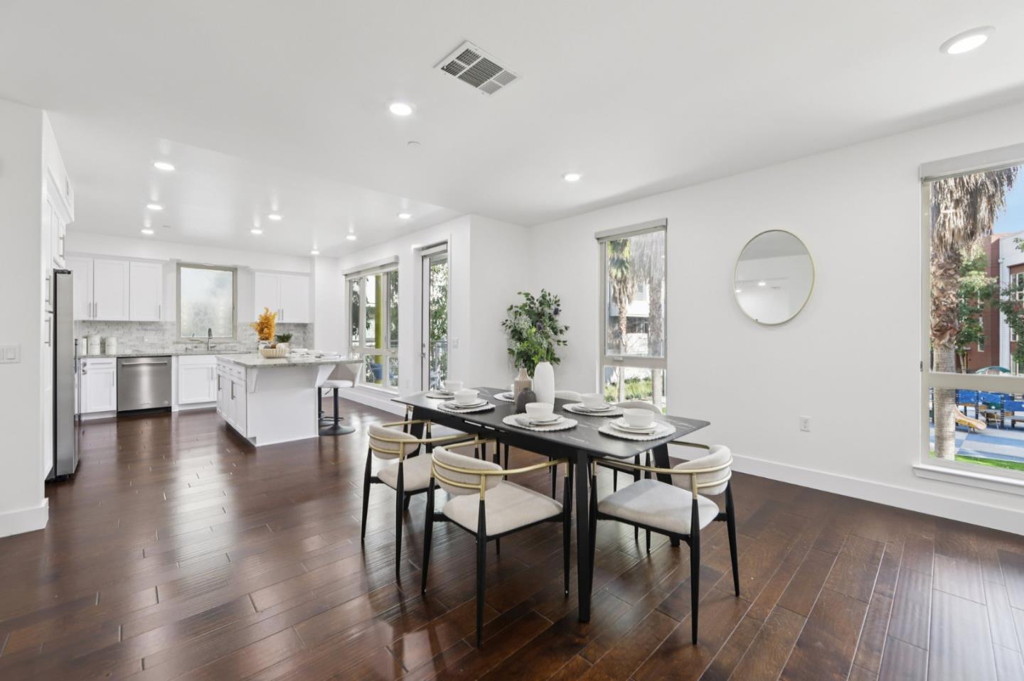 390 Riesling Avenue, Unit 21 Milpitas, CA 95035 - Photo 8 of 48 a view of a dining room with furniture and wooden floor