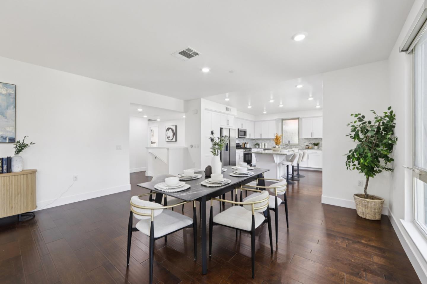 390 Riesling Avenue, Unit 21 Milpitas, CA 95035 - Photo 9 of 48 a view of a dining room with furniture and wooden floor
