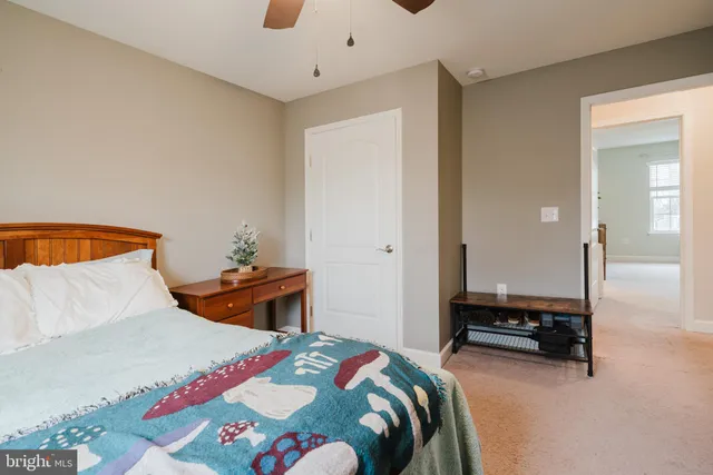 a bedroom with a bed and a lamp