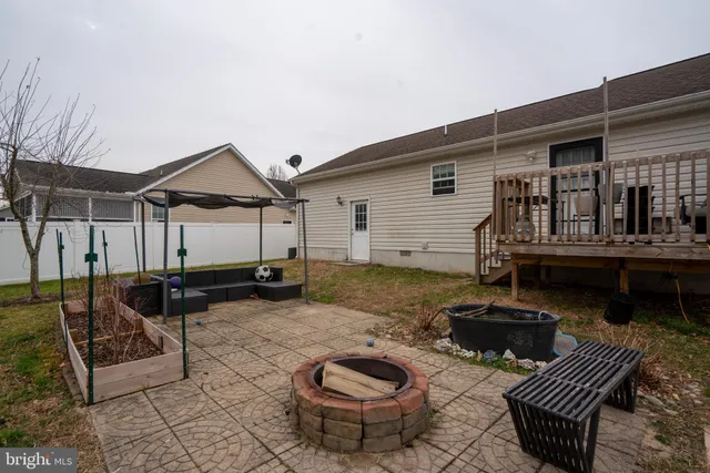 a view of a patio with a chairs and table in the patio